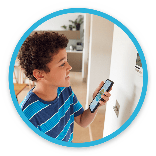A Young Boy Adjusting the Thermostat From His Phone