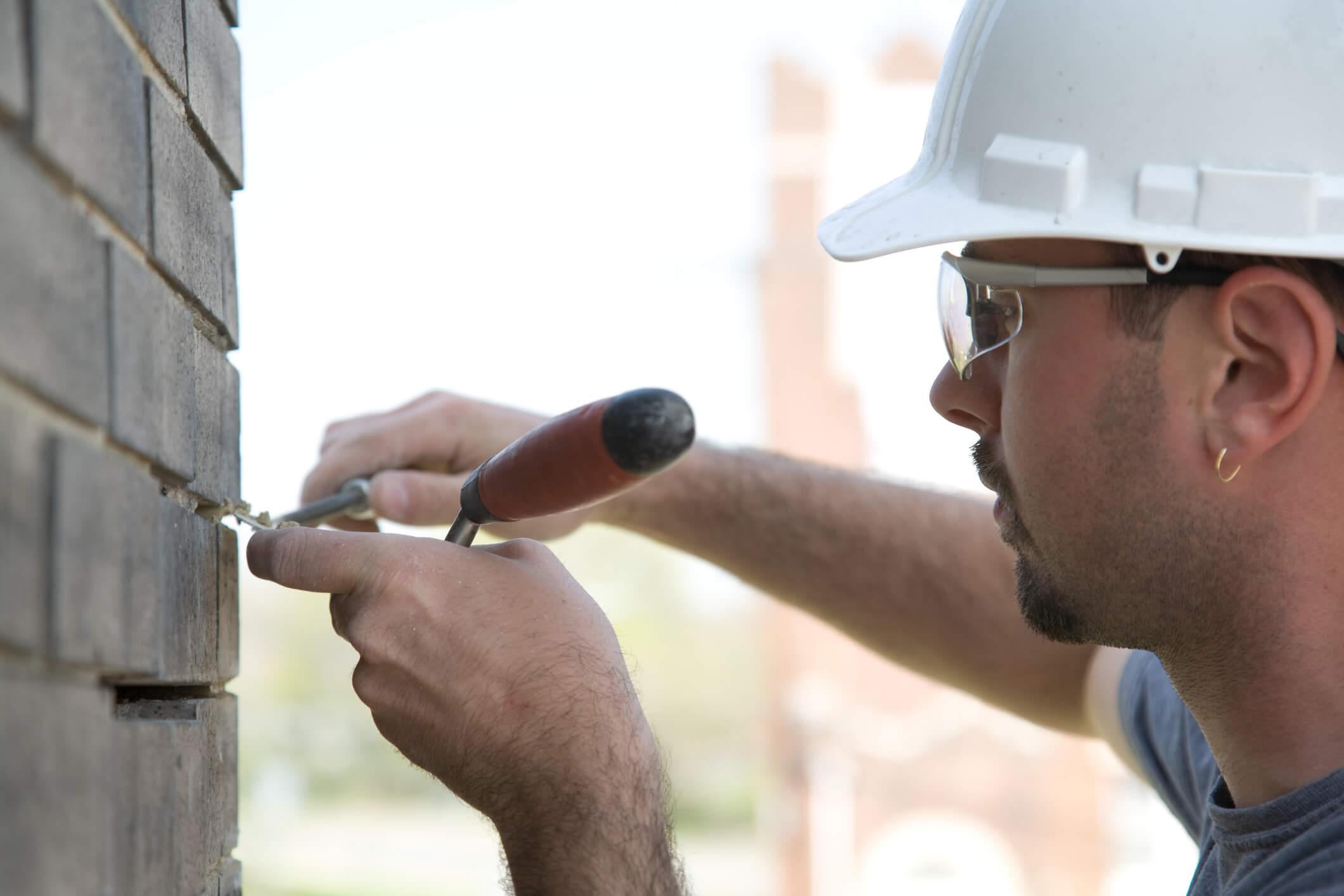man fixing chimney